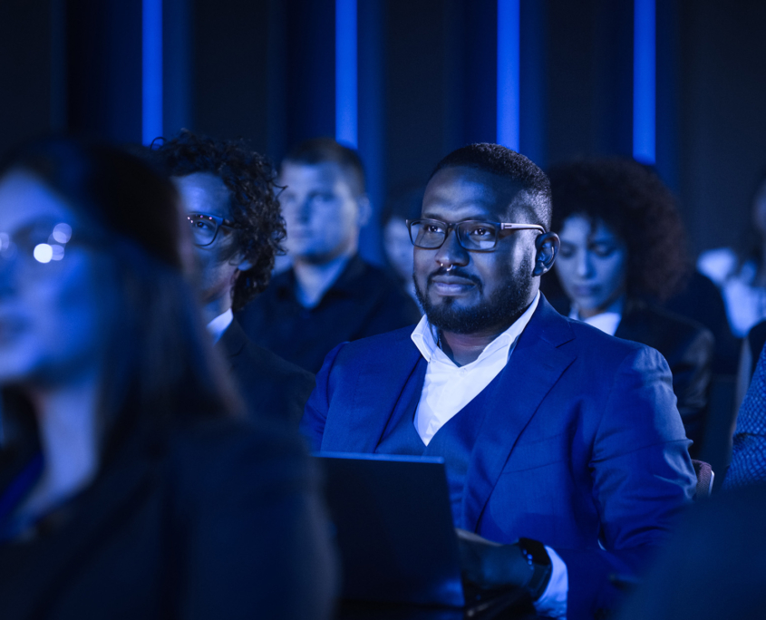 Front View Of Man Sitting In Audience