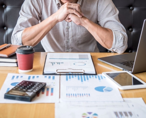 Stock image of employee sitting at desk