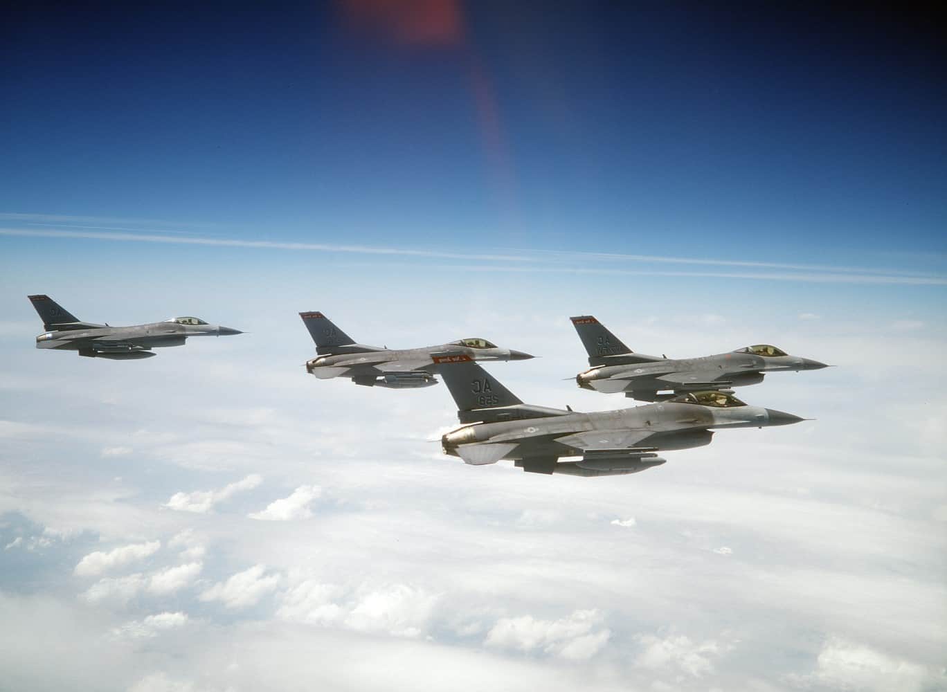 Four fighter jets in the air