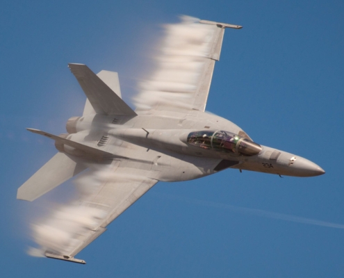 Fighter jet flying through the air