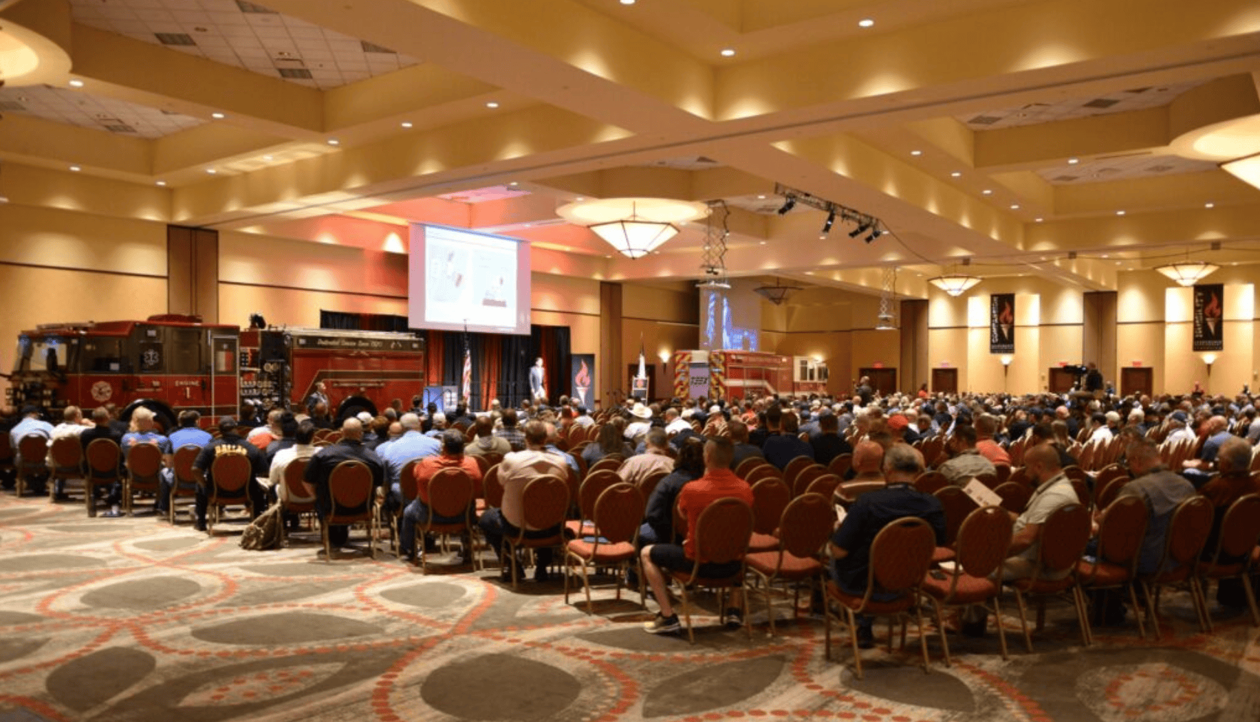 Sideview of audience watching leadership symposium