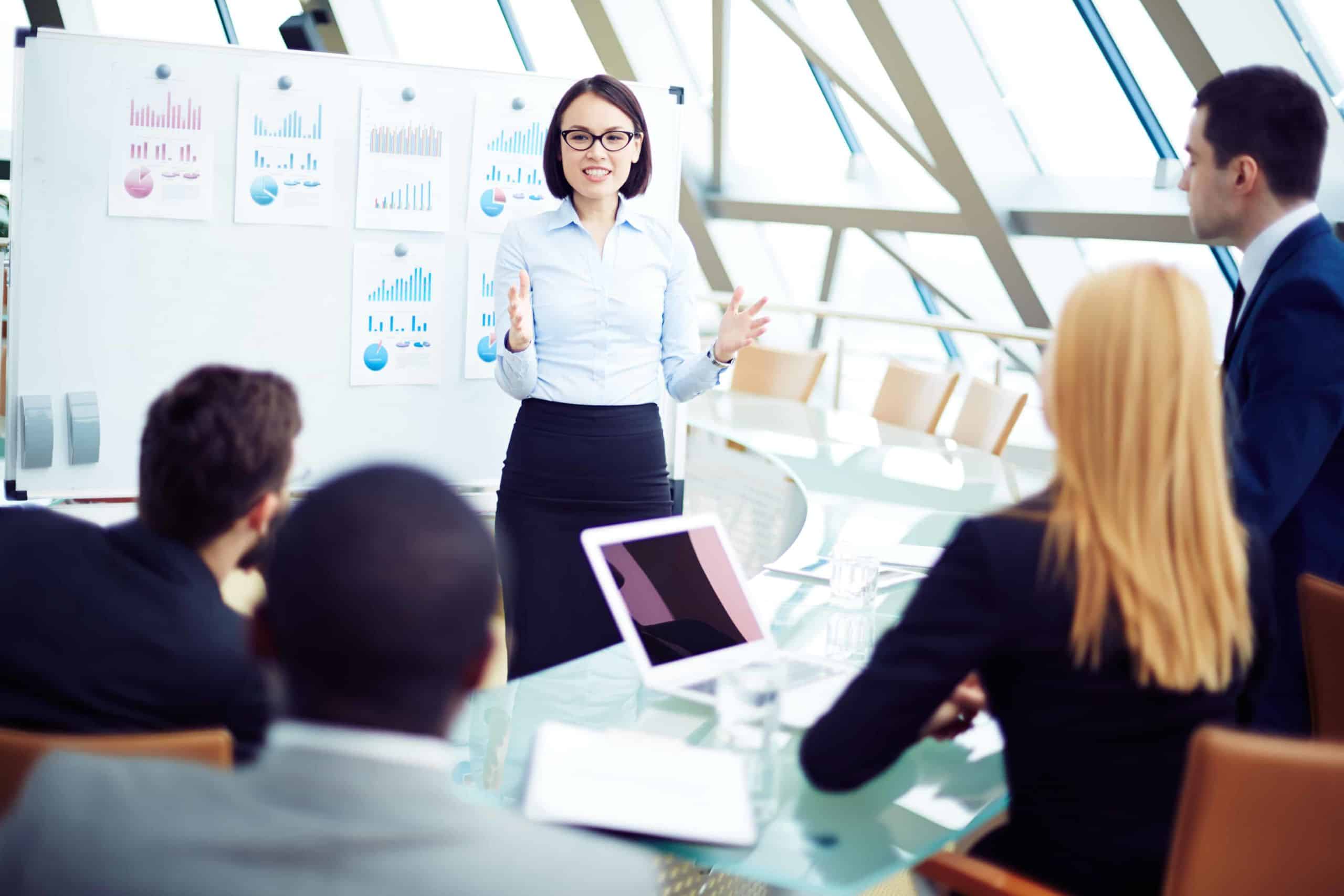 Team leader in front of employees giving presentation