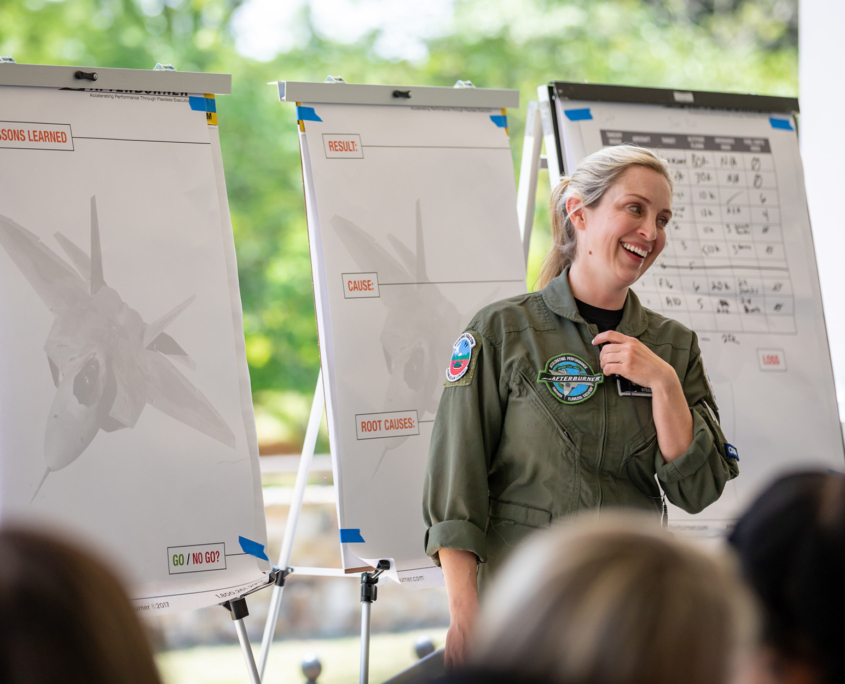 Woman Laughing While Leading Group Activity