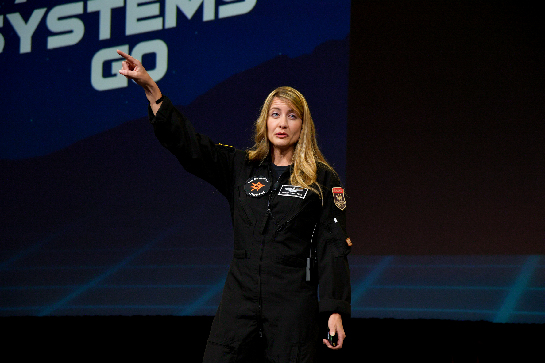 Afterburner pilot on stage during a leadership event