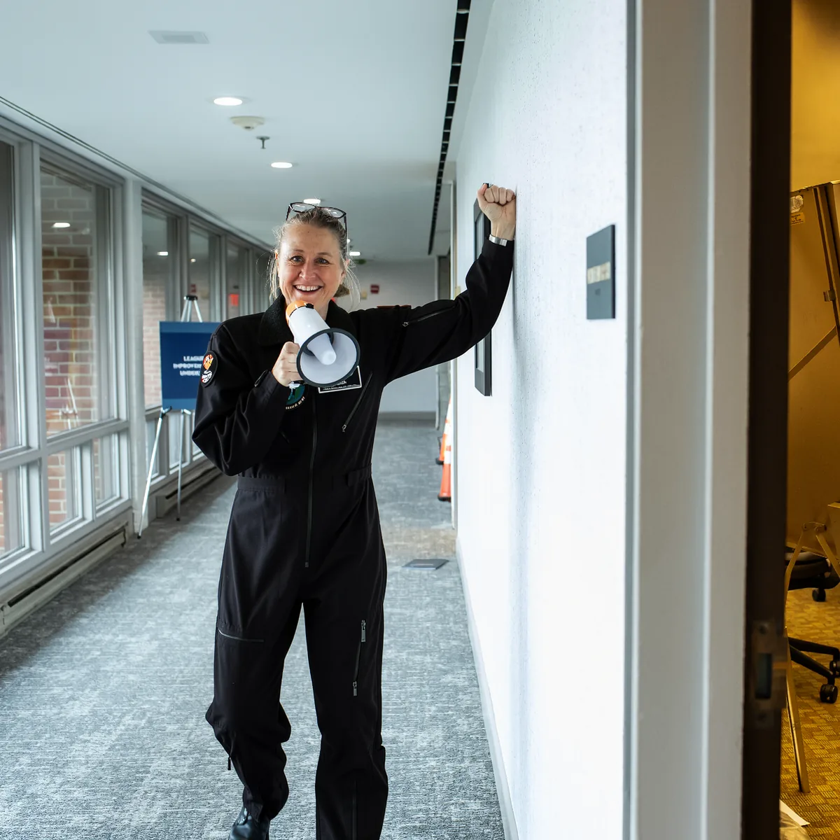 An Afterburner pilot with a megaphone at a client event.